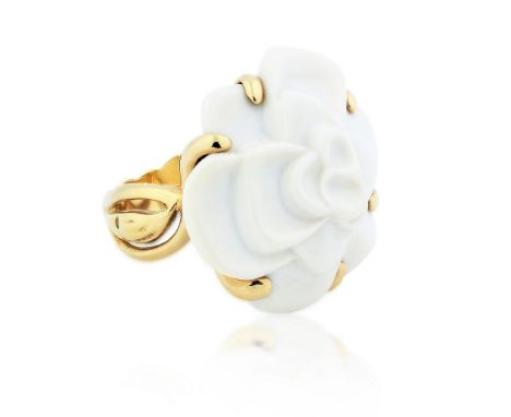 CHANEL 18 KARAT YELLOW GOLD RING Model 'Camelia', centered by a flower carved white agate, Ring size 6.25, signed Chanel