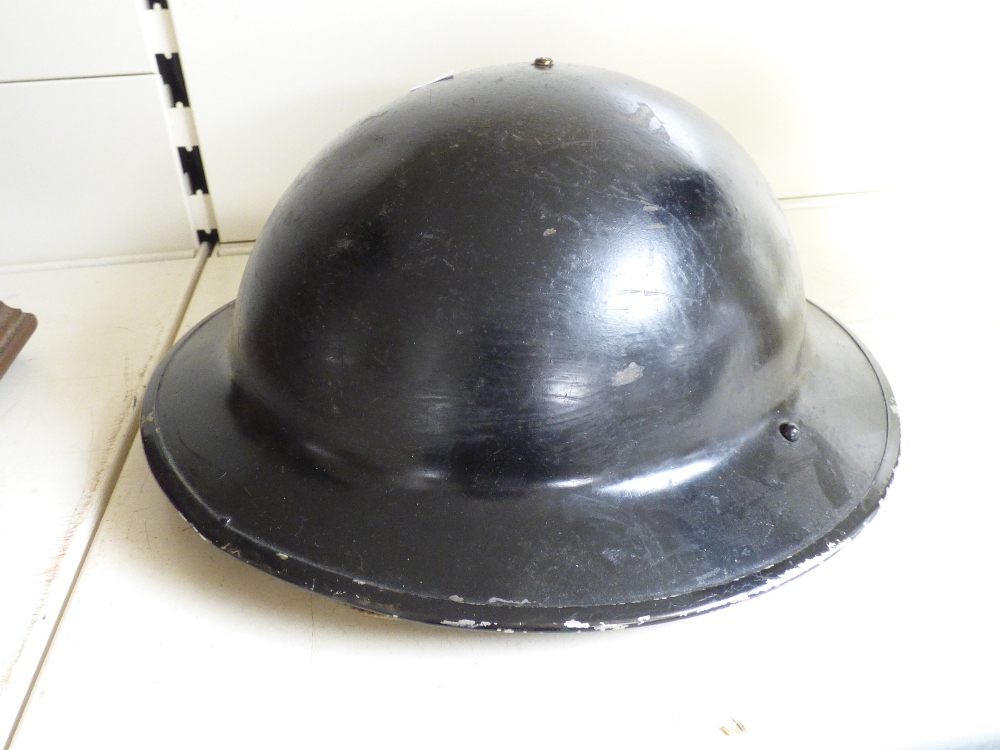 A MILITARY TIN HELMET