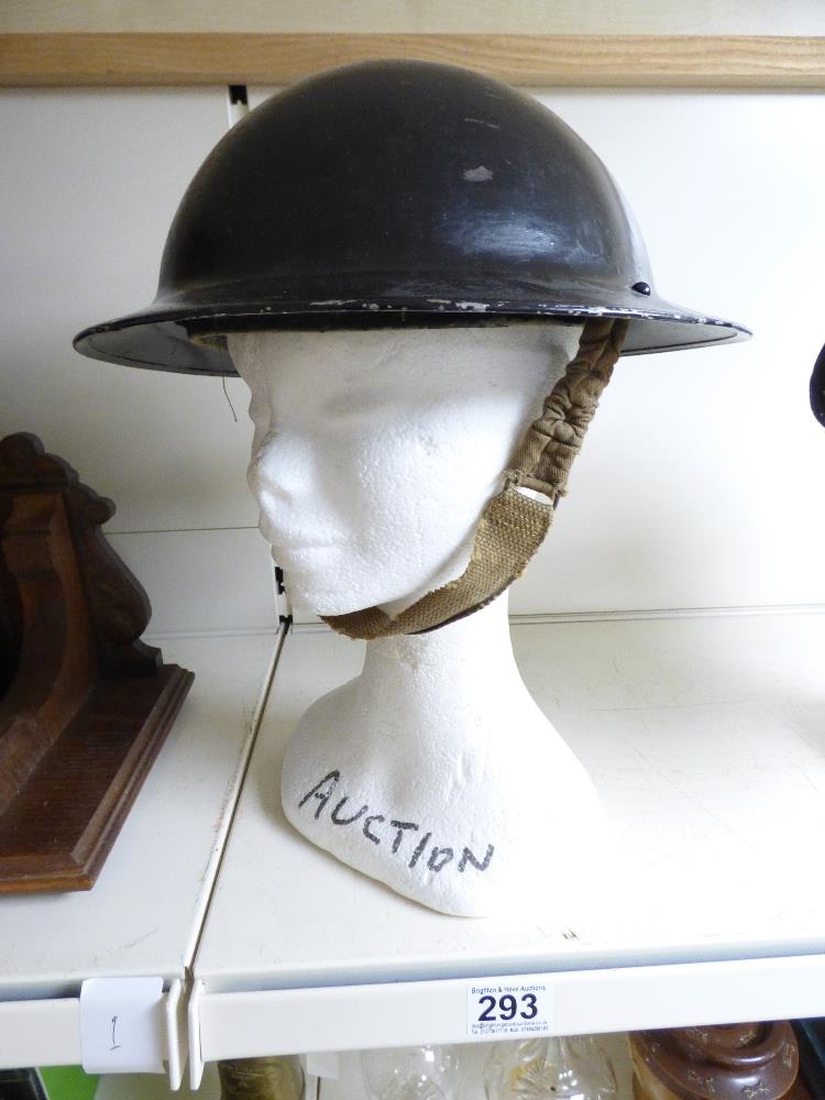 A MILITARY TIN HELMET