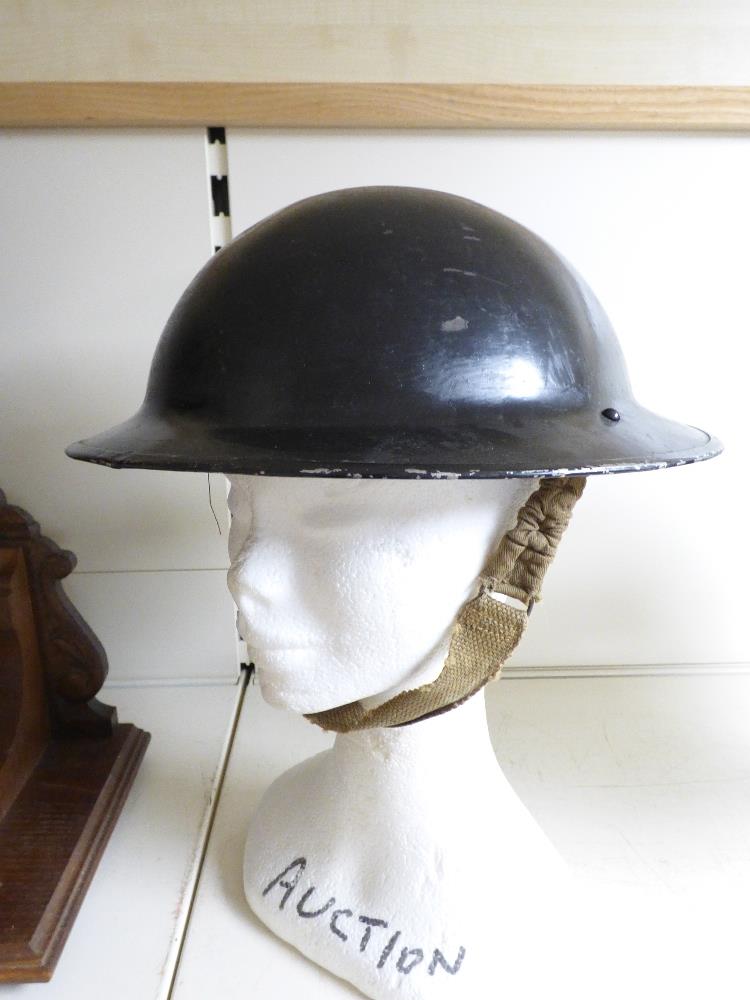 A MILITARY TIN HELMET