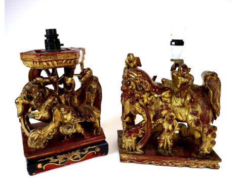 Two similar Chinese carved and painted hardwood temple lion groups (later converted to lamp bases), each with figures astride