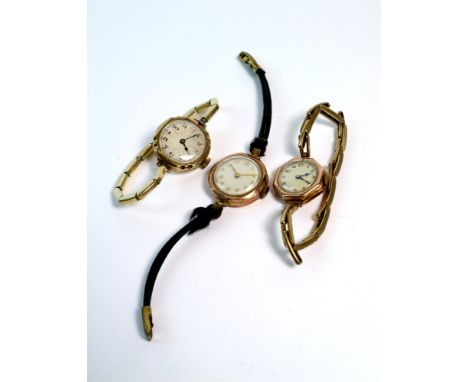 Three wristwatches comprising of a George Arnold Stoll 9ct ladies wristwatch with guilloche dial and black Arabic numerals (r