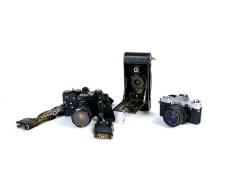 A small collection of 20th century cameras and photographic equipment to include a Zenith 11 SLR, a Carl Zeiss Jena, a Kodak 