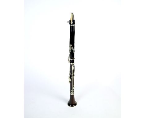 An unboxed French three sectional polished hardwood clarinet, stamped Vasseilliere Fils A Charleville, 68cm long