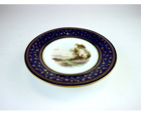 A Royal Worcester low pedestal dish painted by John Stinton dated 1903, centrally painted with male figure seated within rura
