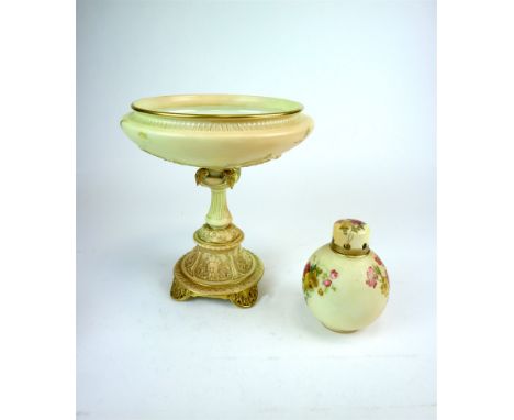 A Royal Worcester blush ivory pedestal dish or tazza the florally painted bowl supported by a stem moulded in relief with bea