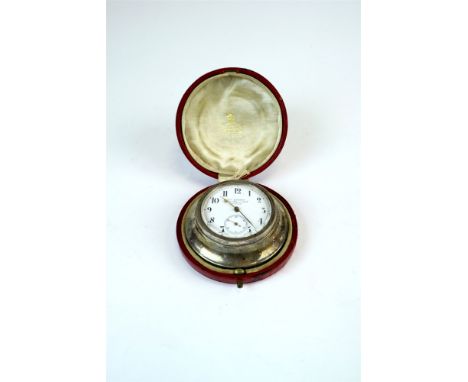 A cased Victorian silver mounted travelling timepiece, W.R.*, London 1896, of circular form, the white enamel dial with black