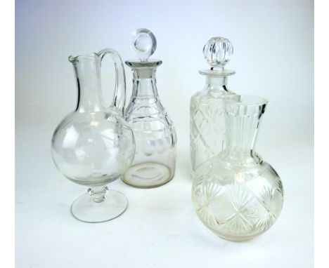 An early 19th century English glass mallet decanter with faceted detail to the body and flattened ovoid stopper, 27.5cm high 