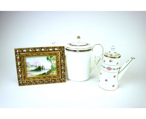 An Edwardian Coalport coffee set comprising coffee pot, milk jug, sugar basin, six coffee cans and saucers decorated with tra