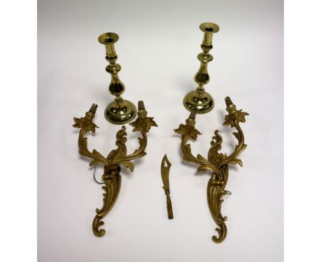 A small collection of brass lighting to include a pair of Rococo style twin-branch wall sconces with scrolling and acanthus d