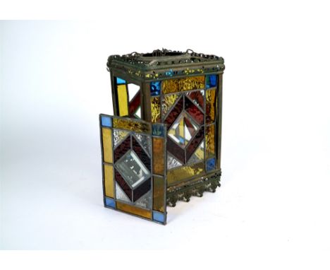 An Edwardian stained glass panelled porch lantern of rectangular form, set with textured glass and shades of blue, amber, red