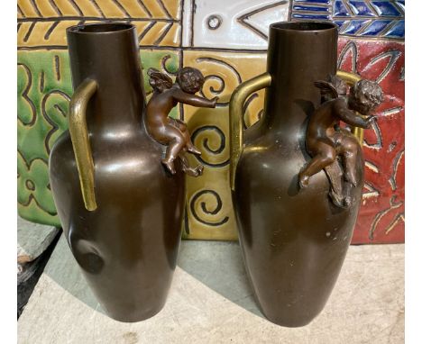 PAIR OF BRONZE CHERUB VASES
