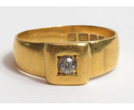 A 22ct gold band ring, set with a single round diamond, approximately 3mm round, ring size R/S but note that band is mis-shap