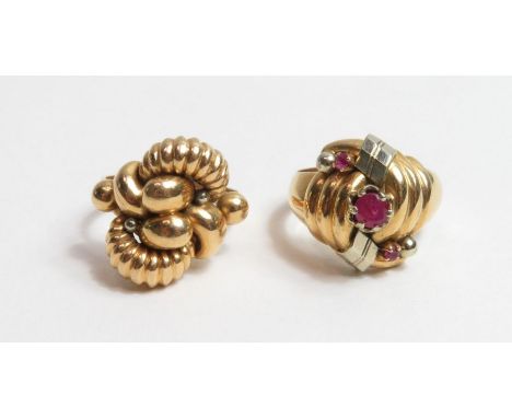 An unusual ring, the head in the form of a stylised knot, set with three round rubies, marks rubbed, ring size Q, 6.67 grams 