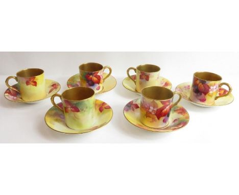 A set of six Royal Worcester porcelain coffee cans and saucers, each signed by Kitty Blake 