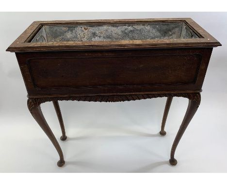A 19th century mahogany plant trough on stand, with a galvanised insert, standing on cabriole legs, 80cm high, 80cm long, 33c