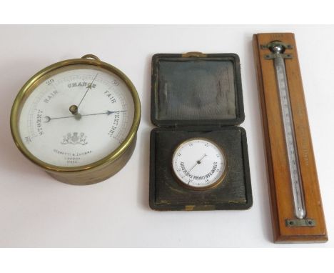 Leather cased gilt pocket barometer and unusual Negretti and Zambra double sleeved wall thermometer in mahogany case No 11169