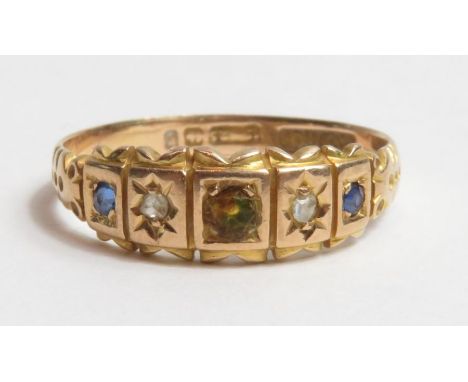 A 15ct gold five stone sapphire and diamond ring, Birmingham, 1898; the centre stone being paste, flanked by two rose cut dia