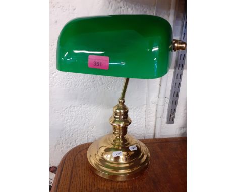 A modern brass desk lamp with green glass shadeLocation: BWR 