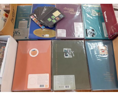 Seven 1990's Australian stamp albums, minus the stamps, with in-depth glossy background information and stamp mounts together