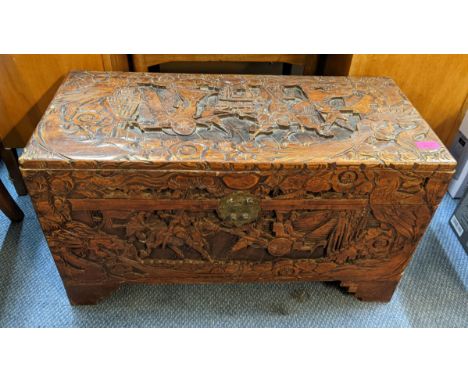 An Asian camphor wood carved chest decorated with figures, on bracket feet, 40cm h x 72cm wLocation: 