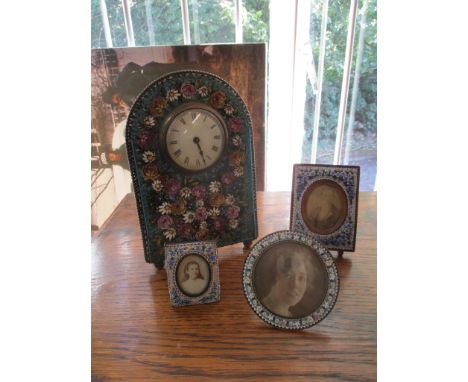 An early 20th century Italian micro mosaic dressing table clock, and three small micro mosaic photograph frames Location: