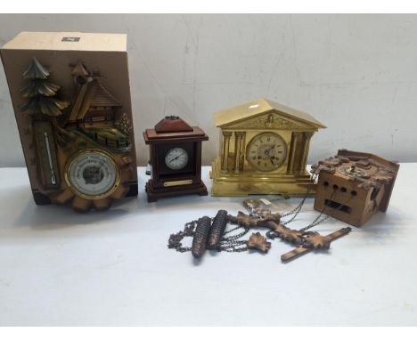 A late 19th century brass cased mantel clock of architectural style together with a Cuckoo clock, mantel clock and a Swiss in