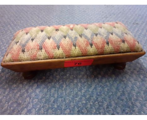 An early mahogany framed pin cushion in the form of a footed tapestry topped stool, 18cm Long x 8cm Deep x 4cm High 
