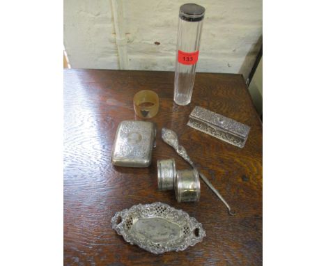 Silver to include a box set with four red paste stones, two napkin rings, a cigarette case, a pin dish 186g, a button hook an