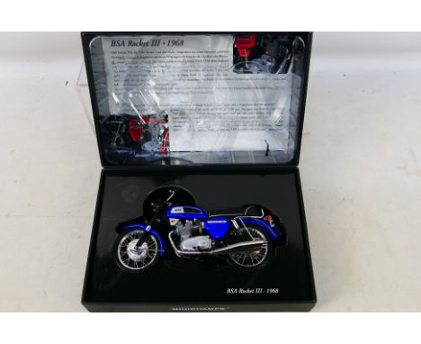 Minichamps - A boxed 1:12 scale 1968 BSA Rocket III model # 130101. The bike is a little dusty from display, the kickstand ha