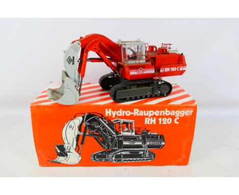 Conrad - A boxed 1:50 scale O&K RH120C Hydraulic Excavator # 2771. The model is dirty from being on display and requires clea