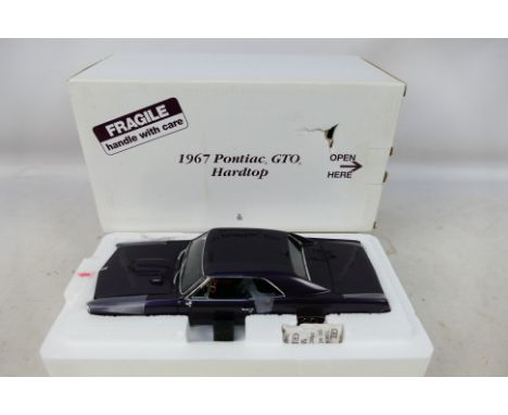 Danbury Mint - A boxed 1/24 scale diecast vehicle 1967 Pontiac GTO Hard Top with original polystyrene inner. Item appears to 