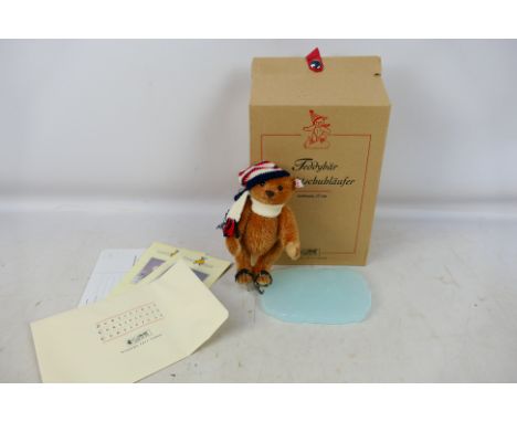 Steiff - A boxed Steiff 'Limited Edition' #037825 'Teddy Bear Ice-Skater'. The reddish brown 17cm bear comes with 'ice' effec
