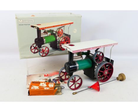 Mamod - A boxed Mamod TE1a Steam Tractor. The model show signs of use and appears in Good overall condition with its steering