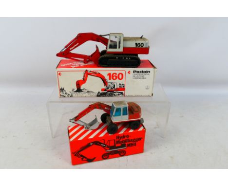 Conrad - NZG - 2 x boxed models in 1:50 scale, O&K MH4 Excavator # 162 and a Poclain 160 Hydraulic Excavator # 2897. They are