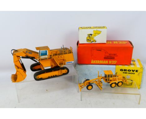 NZG - 2 x unboxed 1:50 scale models, and 3 x additional empty boxes, a Demag H185 Hydraulic Excavator # 241 and a Volvo 3500 