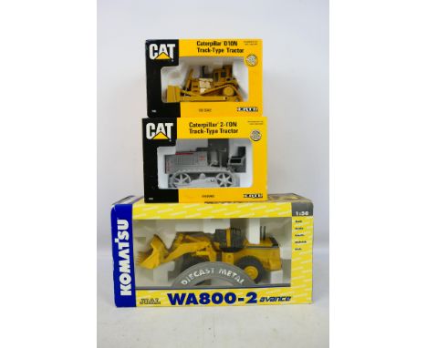 Ertl - Joal - Three boxed diecast construction model vehicles in various scales. Lot consists of Joal #198 1:50 Komatsu WA800