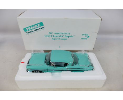 Danbury Mint - A boxed 1/24 scale diecast vehicle 50th Anniversary 1958 Chevrolet Impala Sport Coupe with original polystyren