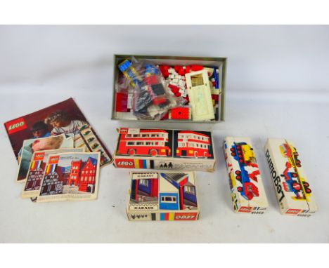 Lego - 4 boxed assembled vintage Lego sets. Includes #313 London Bus (1966). #348 Garage, #681 Low loader with 4 wheel excava
