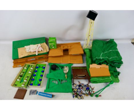 Subbuteo - A collection of mostly unboxed Subbuteo items to include a grand stand, a stadium light, score board, playing figu