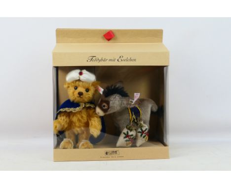 Steiff - A boxed Steiff 'Limited Edition' #670886 'Teddy Bear with Little Donkey'. Both the bear and donkey are still attache