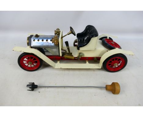 Mamod - An unboxed steam powered white Roadster car in good to very good condition with some signs of use. Item has minor sto