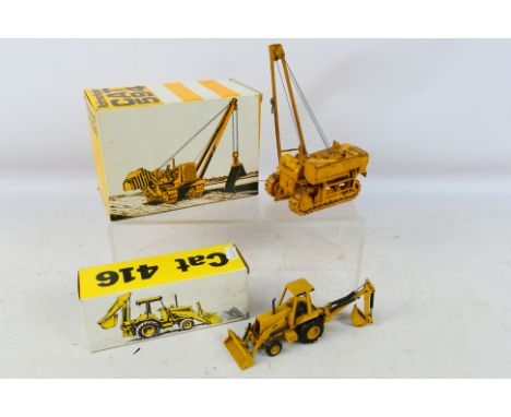 NZG - 2 x boxed 1:50 scale models, a CAT 416 Backhoe Excavator # 285 and a CAT Model # 594 Pipe Layer. The models are dirty f