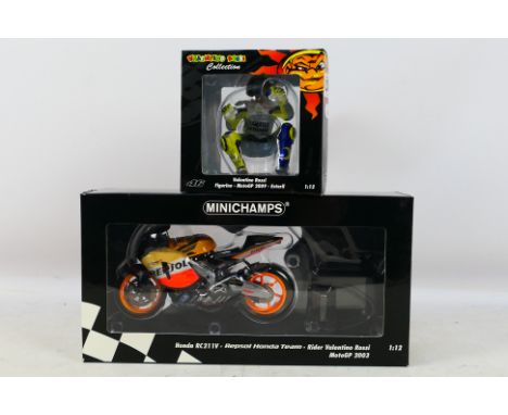 Minichamps - A boxed 1:12 scale Valentino Rossi Repsol Honda RC211V 2003 Moto GP model # 037146. The bike is a little dusty f