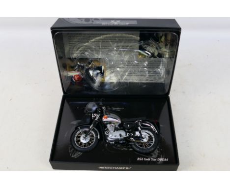 Minichamps - A boxed 1:12 scale 1956 BSA Gold Star DBD34 model # 130000. The bike is a little dusty from display and appears 