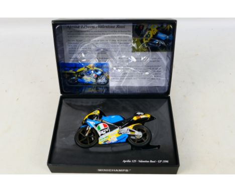 Minichamps - A boxed 1:12 scale 1996 Valentino Rossi Aprilia 125 ccm model # 960046. The bike is a little dusty from display 