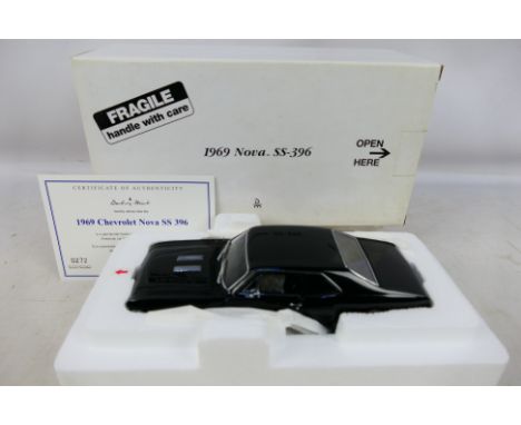 Danbury Mint - A boxed 1/24 scale diecast vehicle 1969 Nova SS-396 with original polystyrene inner. Item appears to be in exc