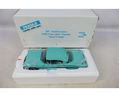 Danbury Mint - A boxed 1/24 scale diecast vehicle 50th Anniversary 1958 Chevrolet Impala Sport Coupe with original polystyren