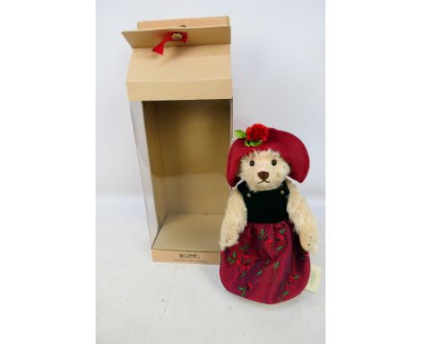 Steiff - A boxed Steiff #028601 Classic Teddy Bear. The blonde 23cm bear comes with Steiff button to ear plus yellow label, a