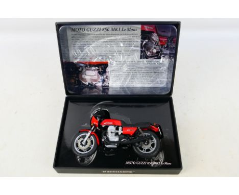 Minichamps - A boxed 1:12 scale Moto Guzzi 850 MkI Le Mans model # 165300. The bike is a little dusty from display and appear